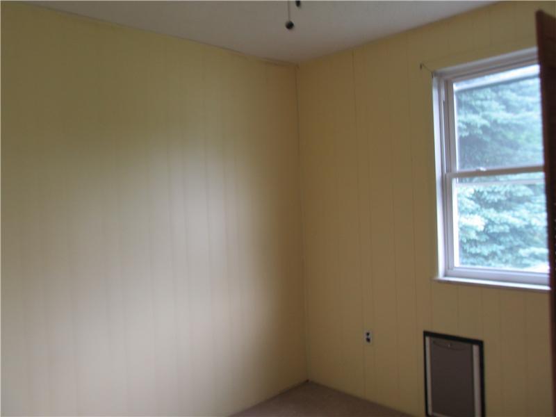 712 Cemetery Road Perryopolis, PA 15473 - Photo 5 of 8 Bedroom. 2nd bedroom is 10 x 10 with a pet door that leads to the outside fenced in pet area