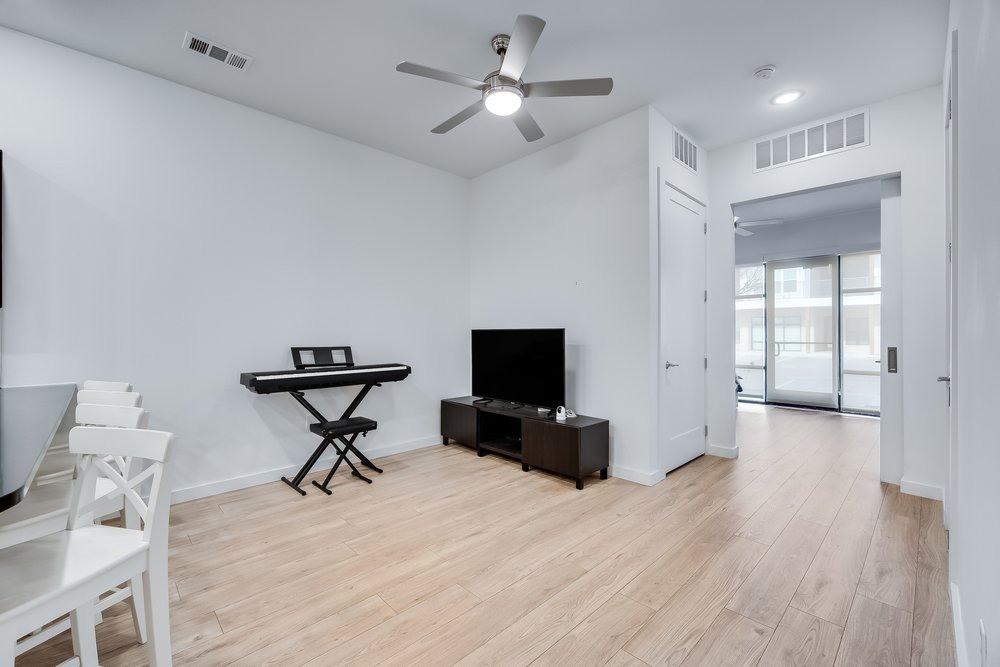 4801 Springdale Road, Unit 2107 Austin, TX 78723 - Photo 10 of 26 a view of a livingroom with furniture and a flat screen tv