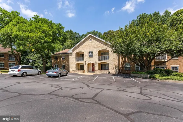 a view of a car park in front of house