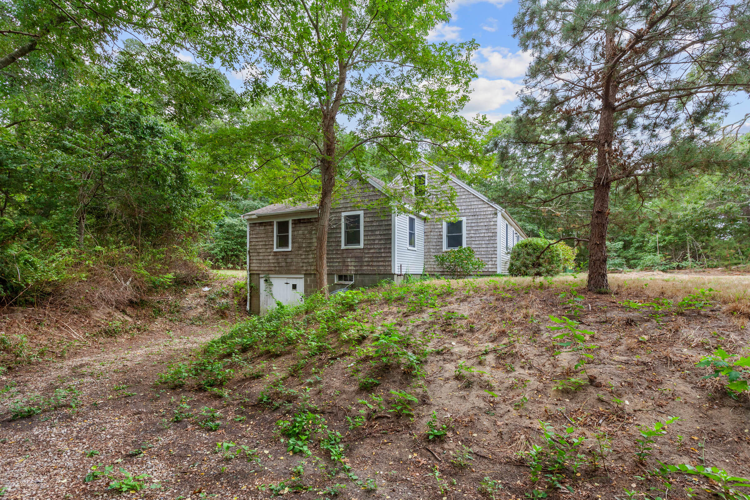 143 Tonset Road Orleans, MA 02653 - Photo 2 of 18 a house view with a backyard space