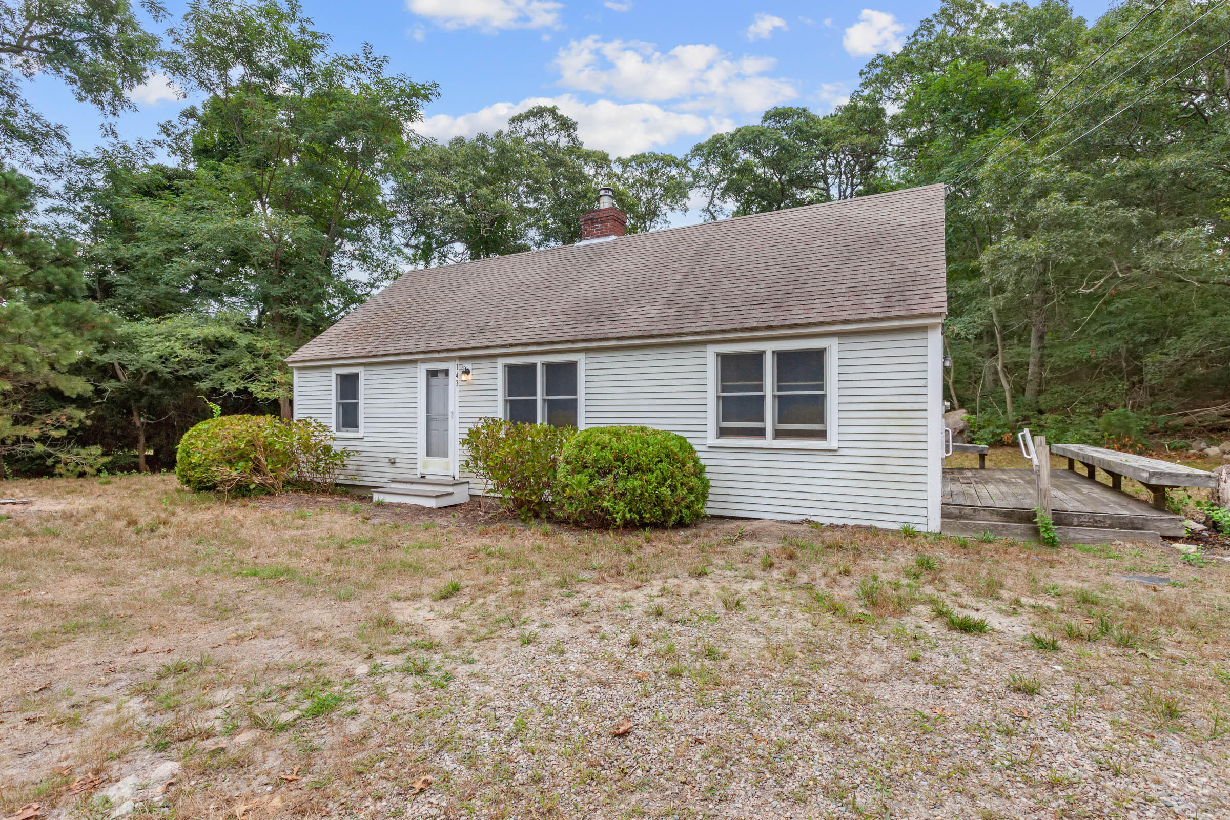 143 Tonset Road Orleans, MA 02653 - Photo 3 of 18 a view of a house with a yard