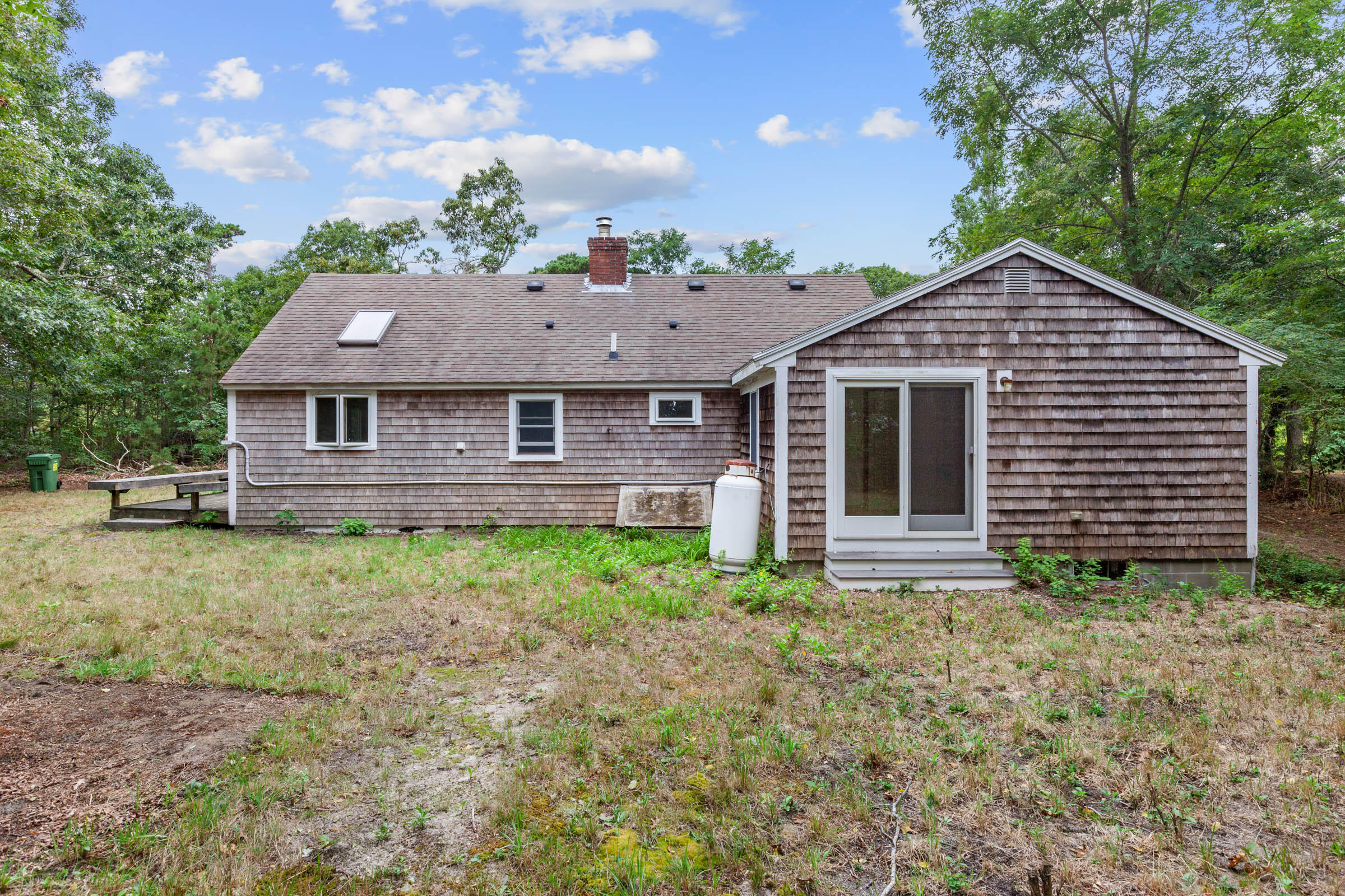 143 Tonset Road Orleans, MA 02653 - Photo 4 of 18 a front view of a house with garden