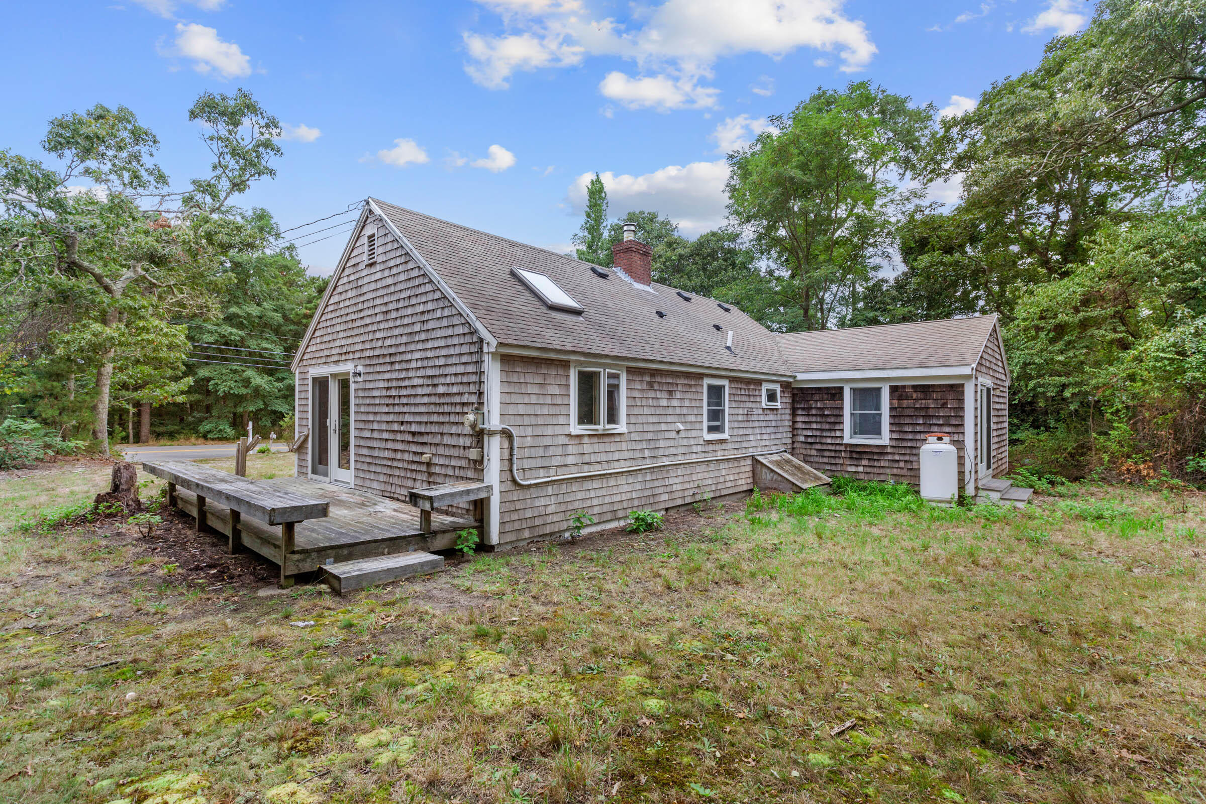 143 Tonset Road Orleans, MA 02653 - Photo 5 of 18 a view of a house with yard and sitting area