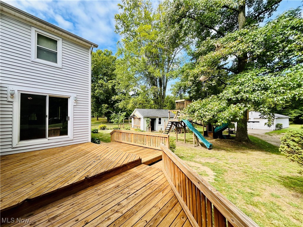 6543 North Ridge Road East Geneva, OH 44041 - Photo 47 of 49 Deck featuring a playground and a lawn