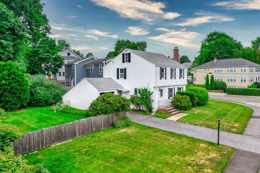 49 Fordham Road Newton, MA 02465 - Photo 13 of 13 a front view of a house with a yard and garage
