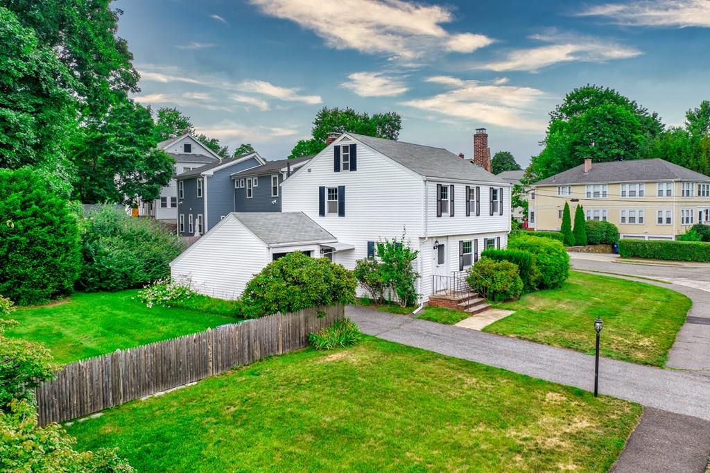 49 Fordham Road Newton, MA 02465 - Photo 3 of 13 a front view of a house with a yard and garage