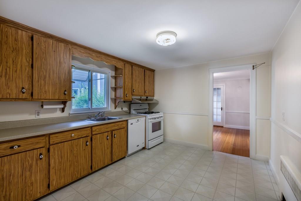 49 Fordham Road Newton, MA 02465 - Photo 6 of 13 a kitchen with a sink and cabinets