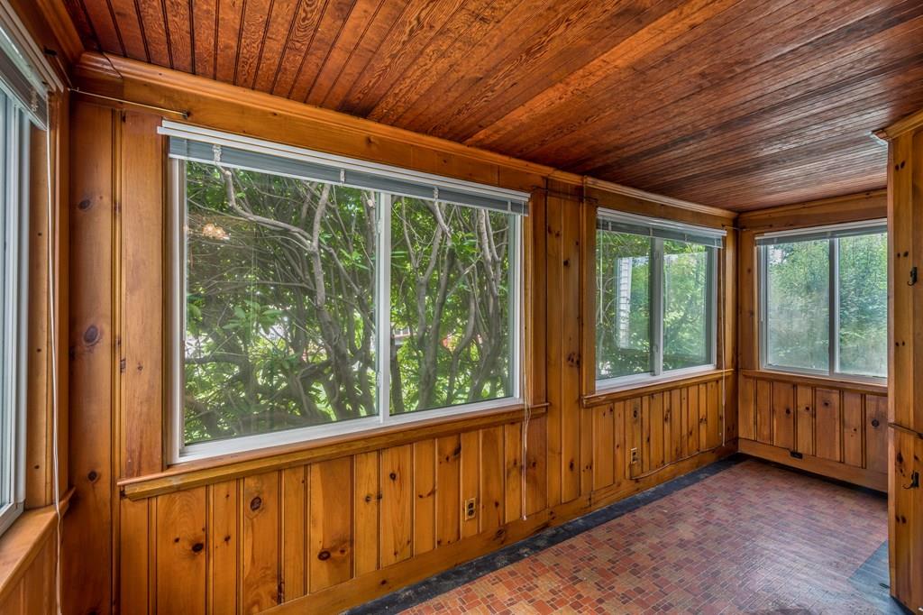 49 Fordham Road Newton, MA 02465 - Photo 7 of 13 a view of an empty room with wooden floor and walls