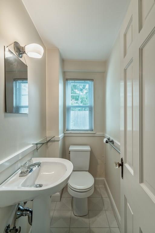 49 Fordham Road Newton, MA 02465 - Photo 8 of 13 a bathroom with a sink a toilet a mirror and shower