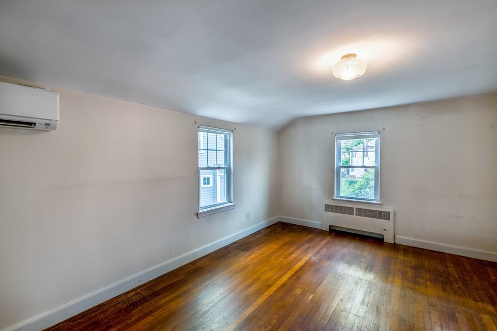 49 Fordham Road Newton, MA 02465 - Photo 10 of 13 an empty room with wooden floor and windows