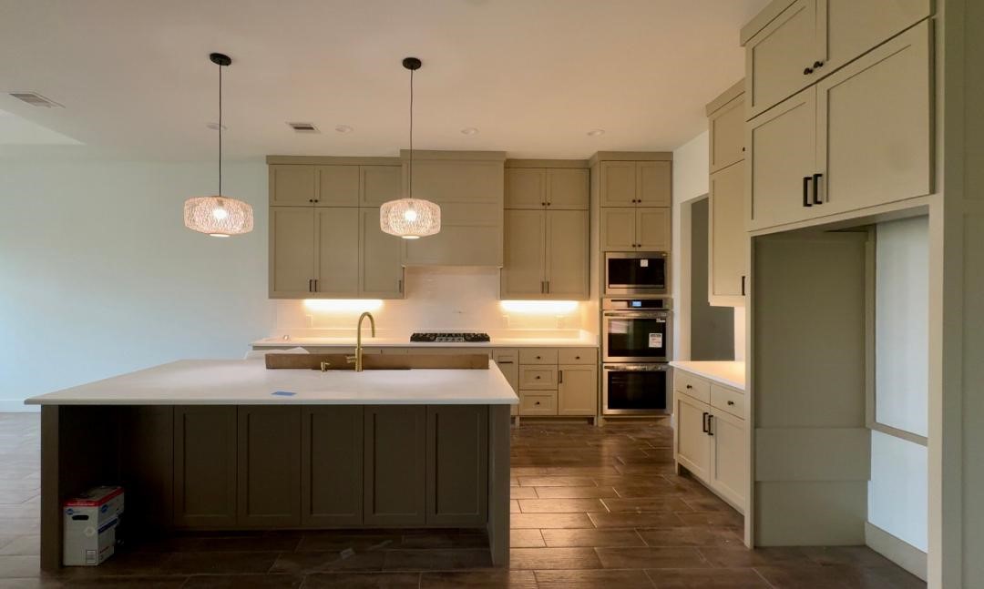 1325 Jared Lumberton, TX 77657 - Photo 4 of 23 a kitchen with a sink a counter space and stainless steel appliances