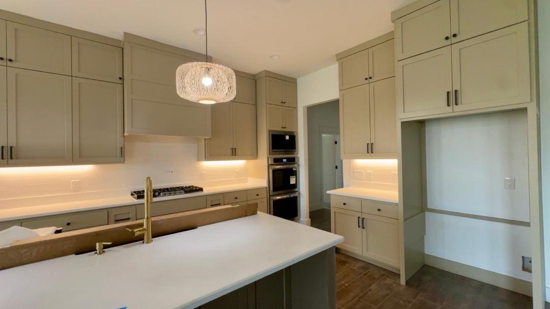1325 Jared Lumberton, TX 77657 - Photo 5 of 23 a kitchen with cabinets and stainless steel appliances
