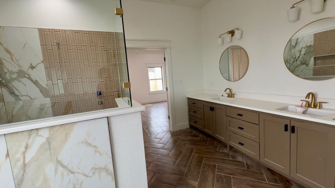 1325 Jared Lumberton, TX 77657 - Photo 10 of 23 a bathroom with a double vanity sink and a mirror