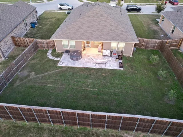a aerial view of a house with a yard