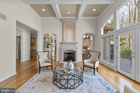 a view of a dining room with furniture window and a fireplace
