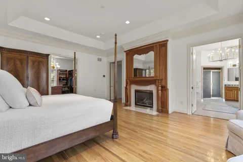 a bedroom with a bed and a lamp next to a window