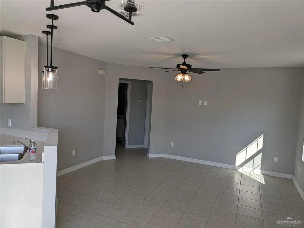 2104 Multi National Harlingen, TX 78550 - Photo 4 of 9 a view of an empty room with a ceiling fan