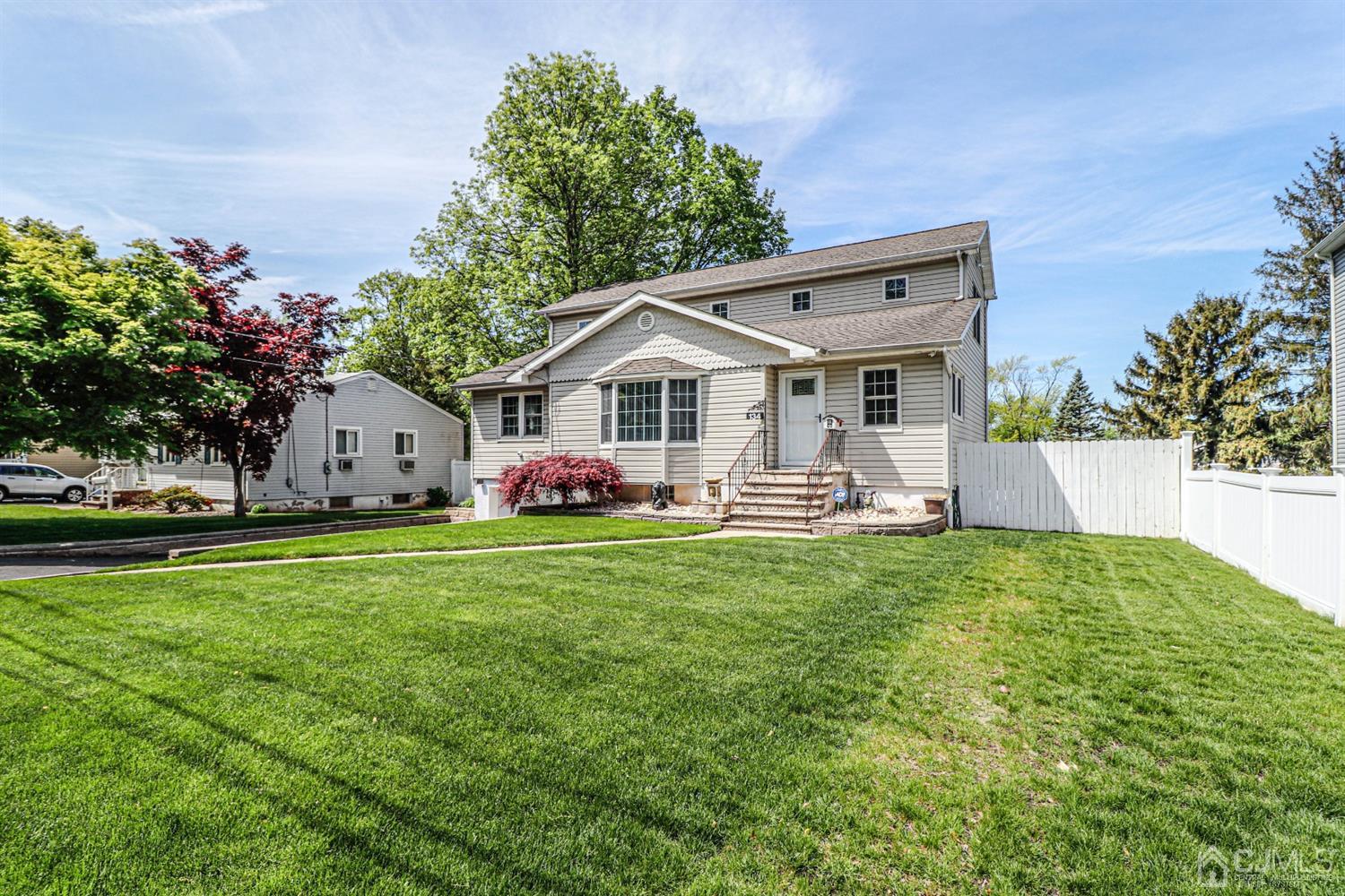 a front view of house with yard and outdoor seating