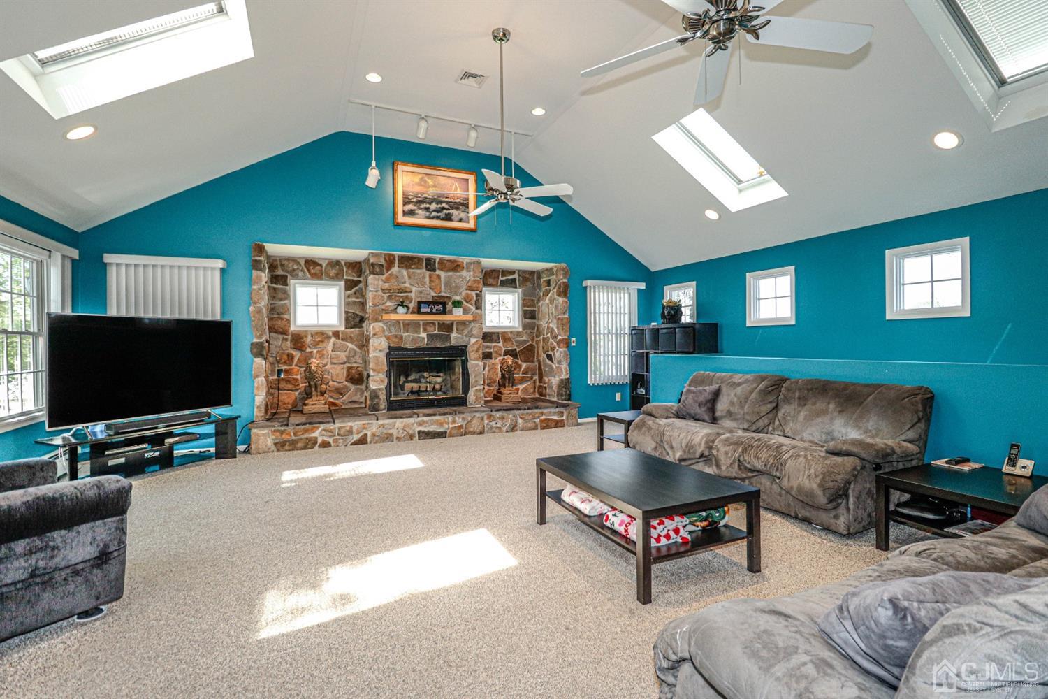 134 Normandy Road Colonia, NJ 07067 - Photo 11 of 45 a living room with furniture and a flat screen tv