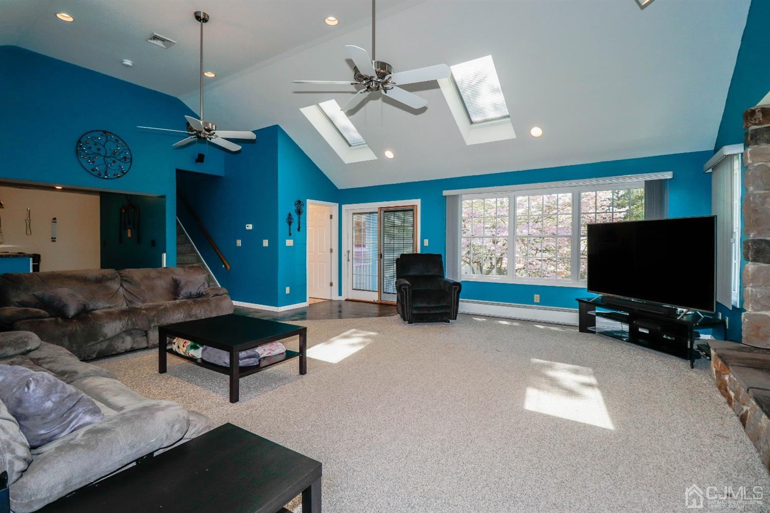 134 Normandy Road Colonia, NJ 07067 - Photo 13 of 45 a living room with furniture and a flat screen tv