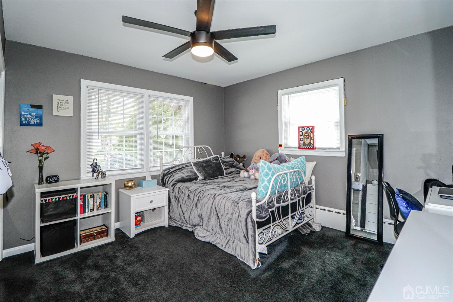 134 Normandy Road Colonia, NJ 07067 - Photo 16 of 45 a bedroom with a bed and a chandelier