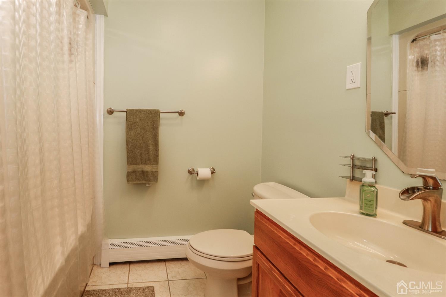 134 Normandy Road Colonia, NJ 07067 - Photo 17 of 45 a bathroom with a sink toilet and shower