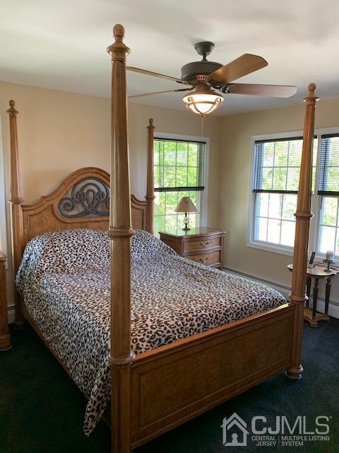 134 Normandy Road Colonia, NJ 07067 - Photo 19 of 45 a bed sitting in a bedroom next to a window