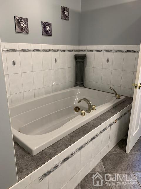 134 Normandy Road Colonia, NJ 07067 - Photo 26 of 45 a bathroom with a bathtub and sink