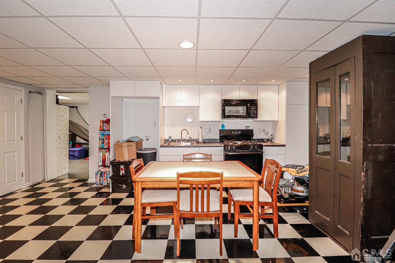 134 Normandy Road Colonia, NJ 07067 - Photo 29 of 45 a kitchen with a sink a stove and refrigerator