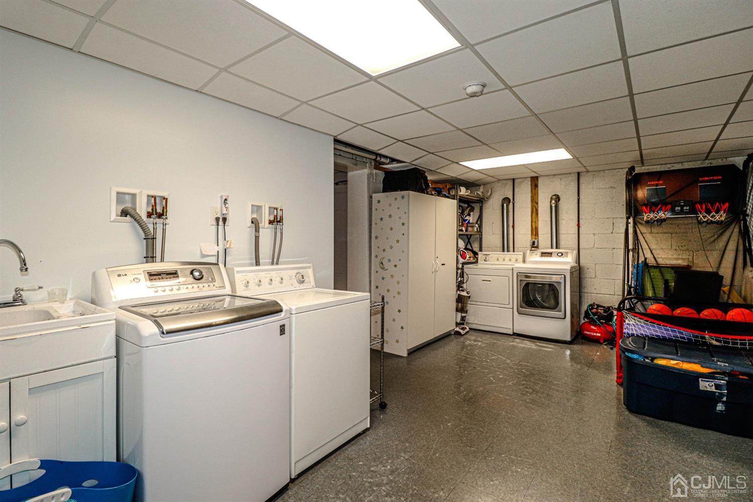 134 Normandy Road Colonia, NJ 07067 - Photo 32 of 45 a utility room with closet dryer and washer