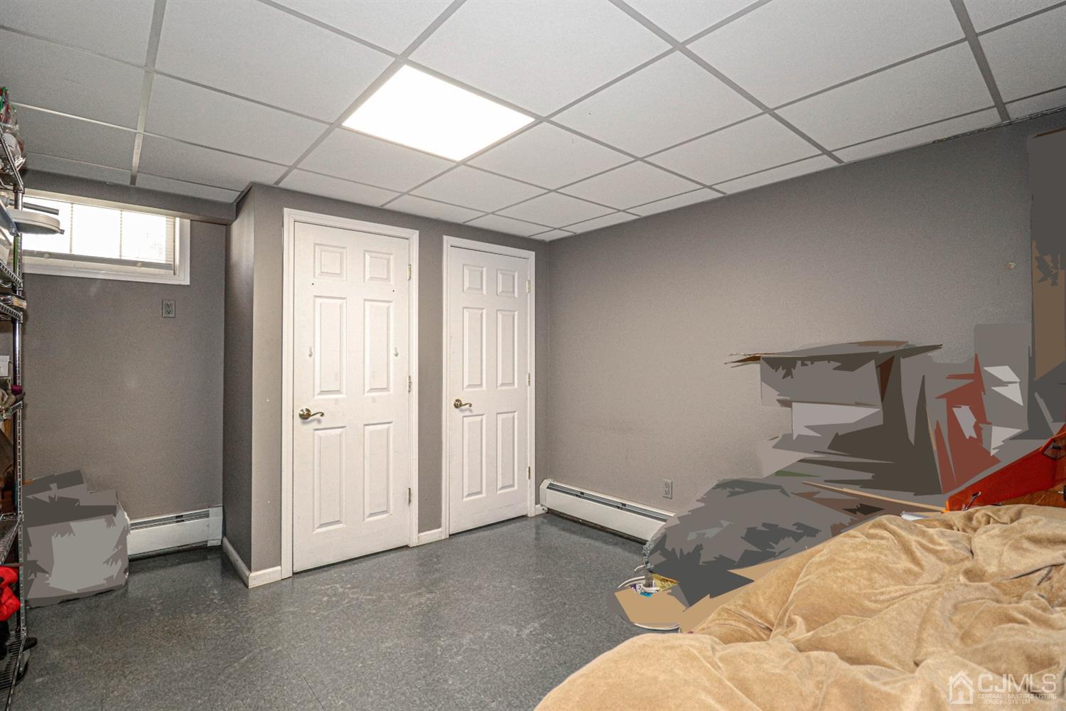 134 Normandy Road Colonia, NJ 07067 - Photo 33 of 45 a bedroom with a bed and a cabinets