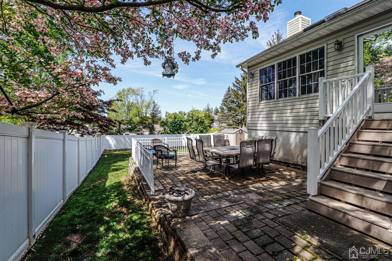 134 Normandy Road Colonia, NJ 07067 - Photo 36 of 45 a view of a chair and tables on the deck