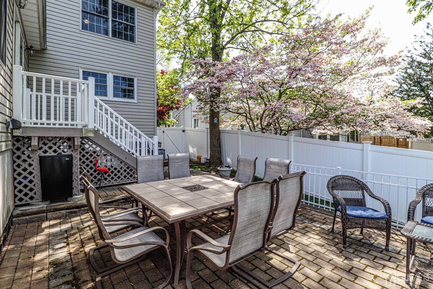 134 Normandy Road Colonia, NJ 07067 - Photo 37 of 45 a view of a dinning table and chairs in patio