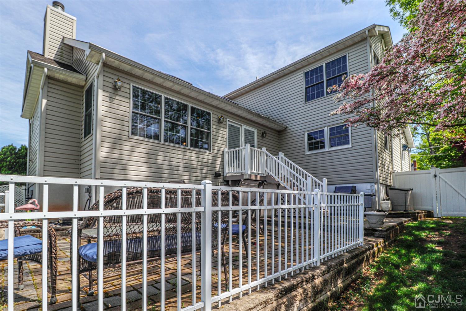 134 Normandy Road Colonia, NJ 07067 - Photo 38 of 45 a front view of a house with a garden