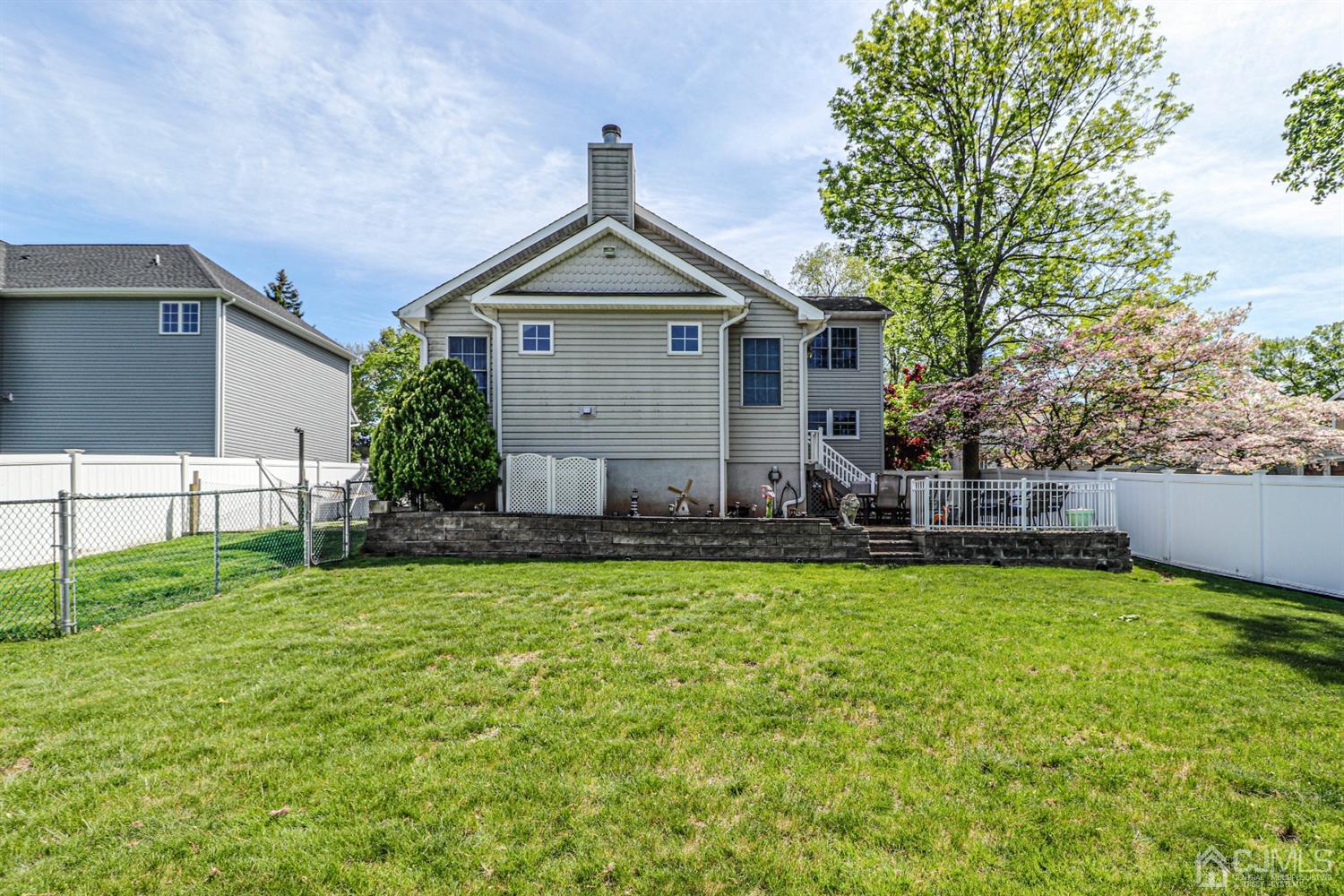 134 Normandy Road Colonia, NJ 07067 - Photo 40 of 45 a front view of a house with a yard
