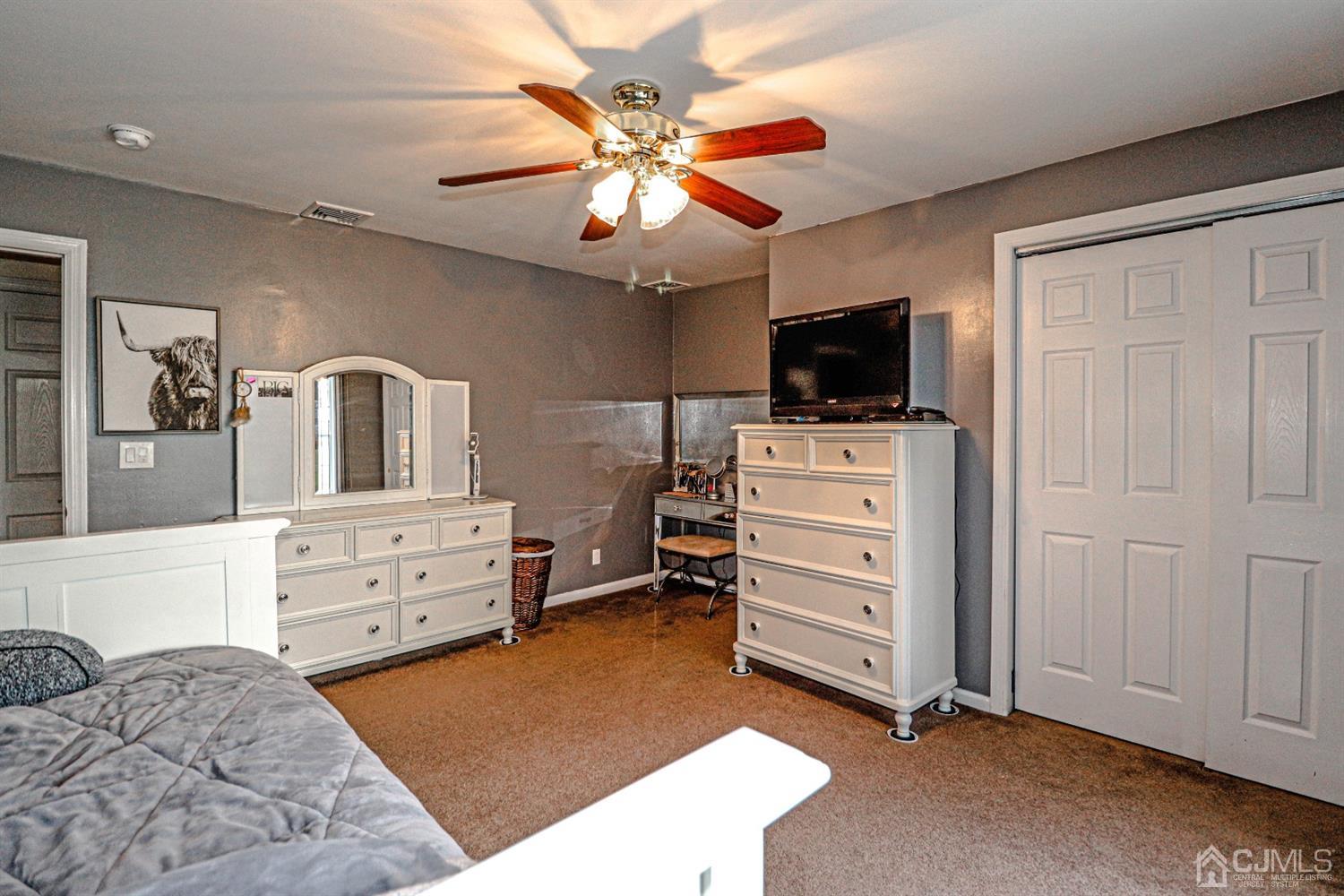 134 Normandy Road Colonia, NJ 07067 - Photo 44 of 45 a room with furniture and flat screen tv
