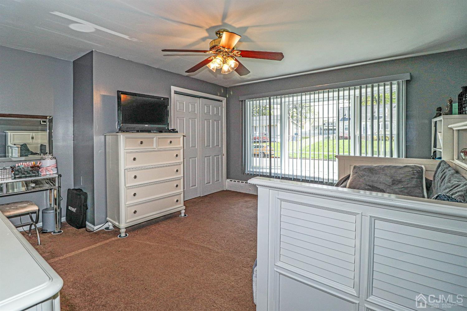 134 Normandy Road Colonia, NJ 07067 - Photo 45 of 45 a bedroom with a bed and a television