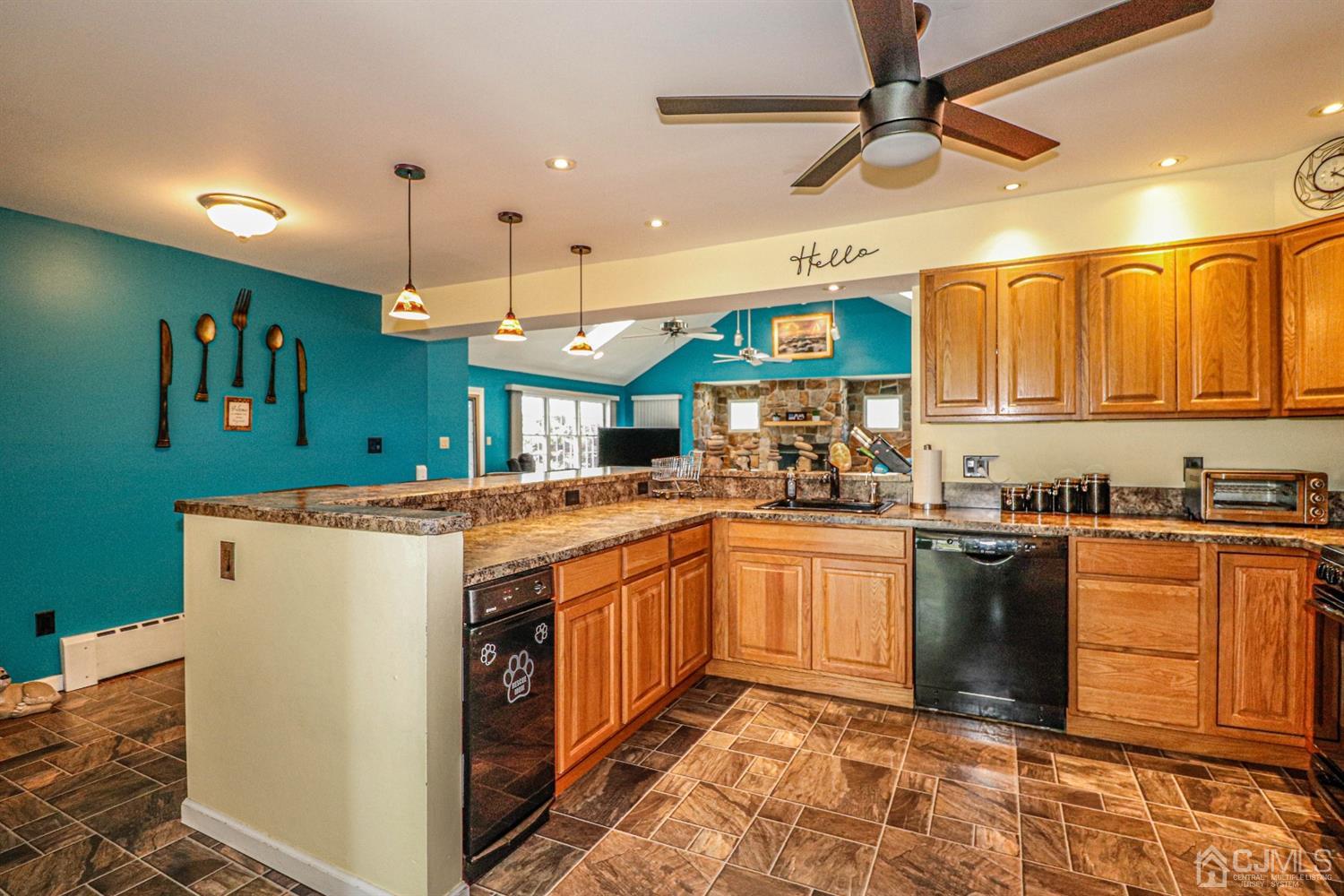 134 Normandy Road Colonia, NJ 07067 - Photo 7 of 45 a kitchen with stainless steel appliances granite countertop a sink and a refrigerator