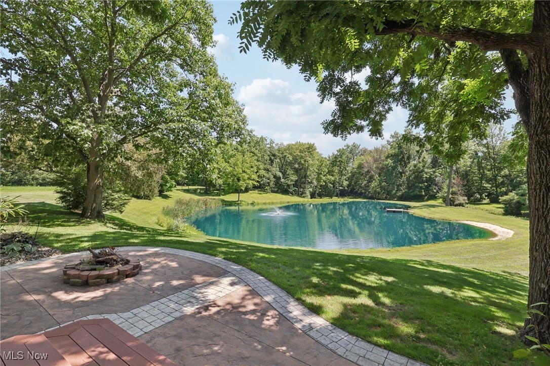 6414 Tennant Road Collins, OH 44826 - Photo 3 of 50 View of pond featuring a water view, a yard, and an outdoor fire pit