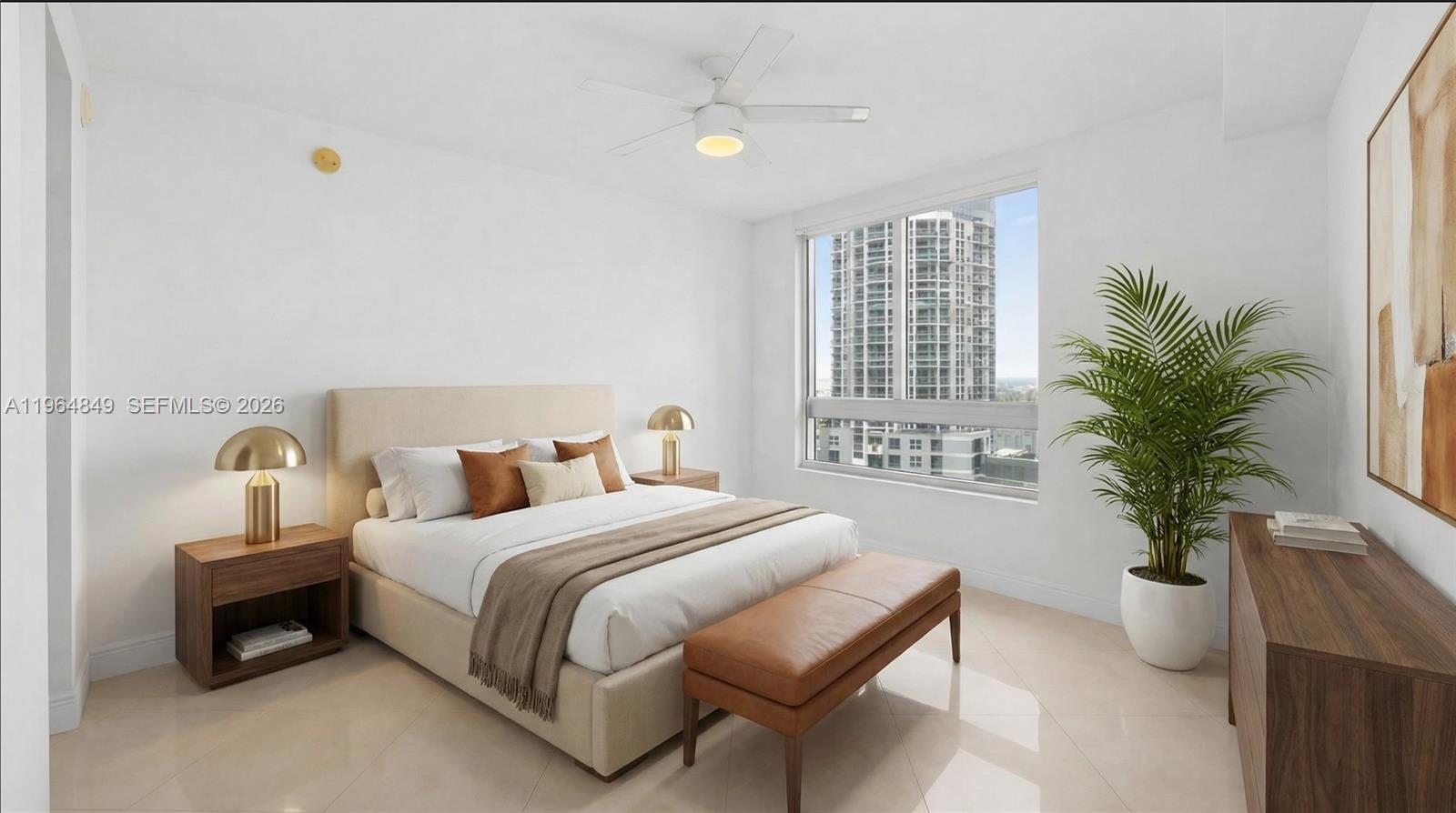 a bedroom with bed and a potted plant