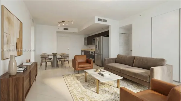 a living room with furniture wooden floor and a chandelier