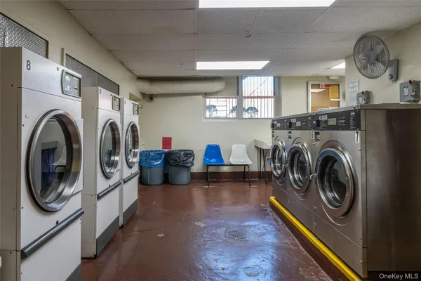 a view of a storage and utility room with washer and dryer