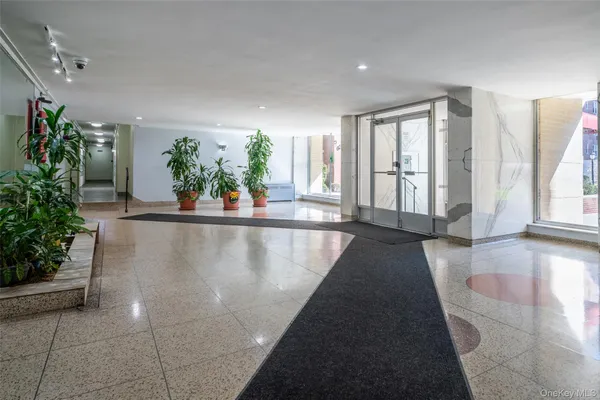 a view of a living room and entryway