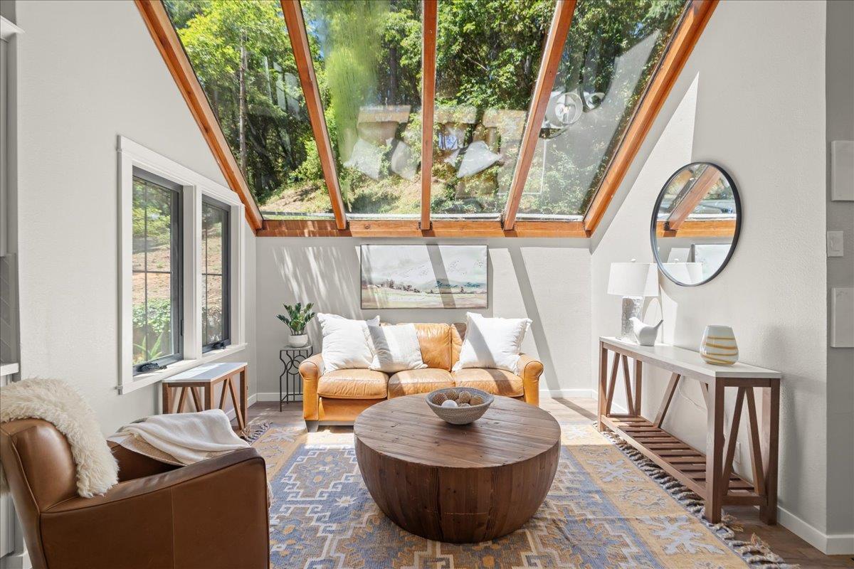 19005 Old Vineyard Road Los Gatos, CA 95033 - Photo 13 of 51 a living room with furniture a rug and a large window