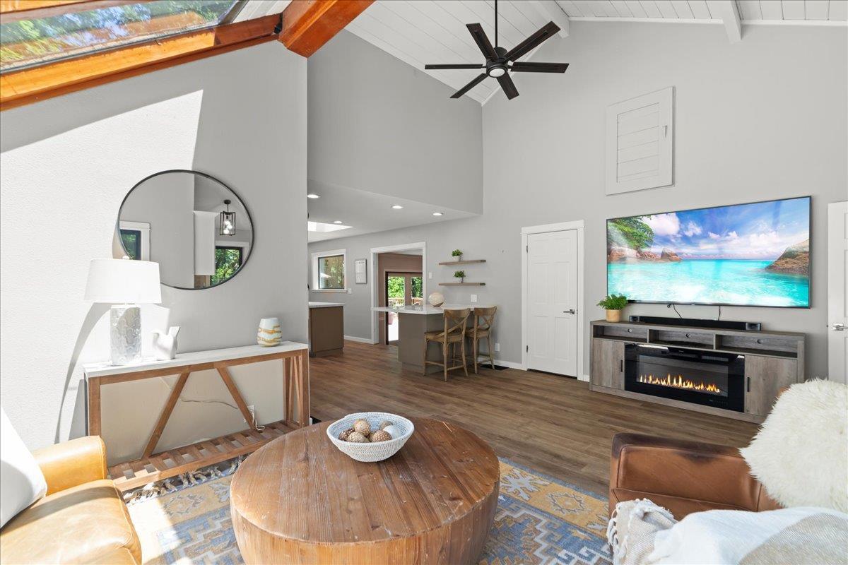 19005 Old Vineyard Road Los Gatos, CA 95033 - Photo 14 of 51 a living room with furniture and a flat screen tv