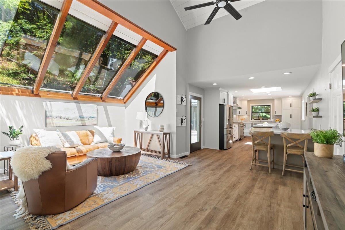 19005 Old Vineyard Road Los Gatos, CA 95033 - Photo 15 of 51 a living room with furniture a wooden floor and a window