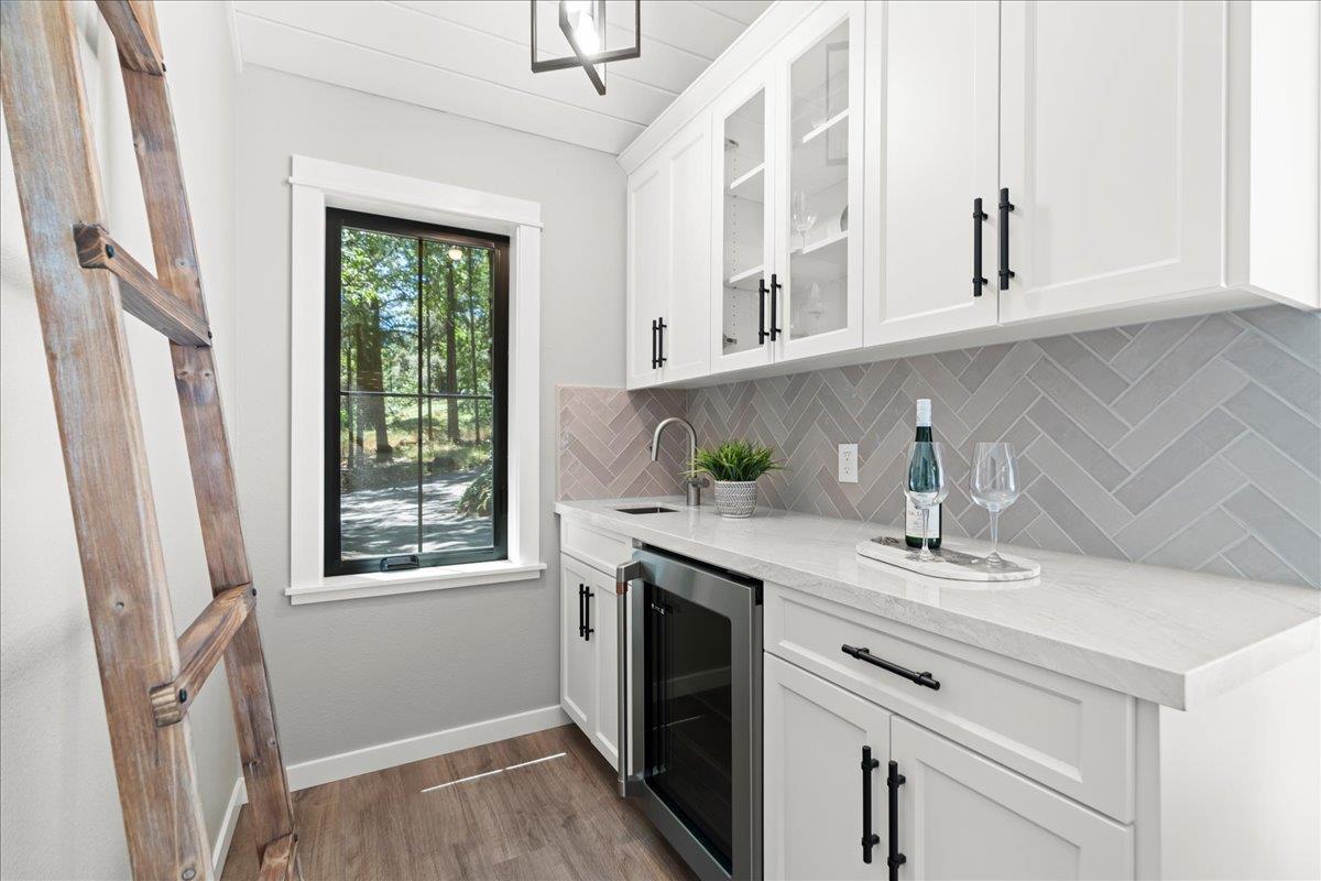 19005 Old Vineyard Road Los Gatos, CA 95033 - Photo 16 of 51 a kitchen with stainless steel appliances white cabinets and a sink