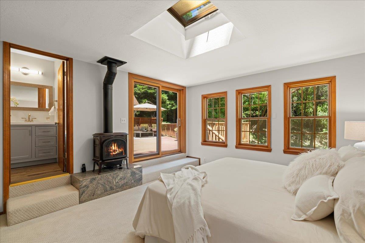 19005 Old Vineyard Road Los Gatos, CA 95033 - Photo 19 of 51 a bedroom with a bed and a large window with outer view