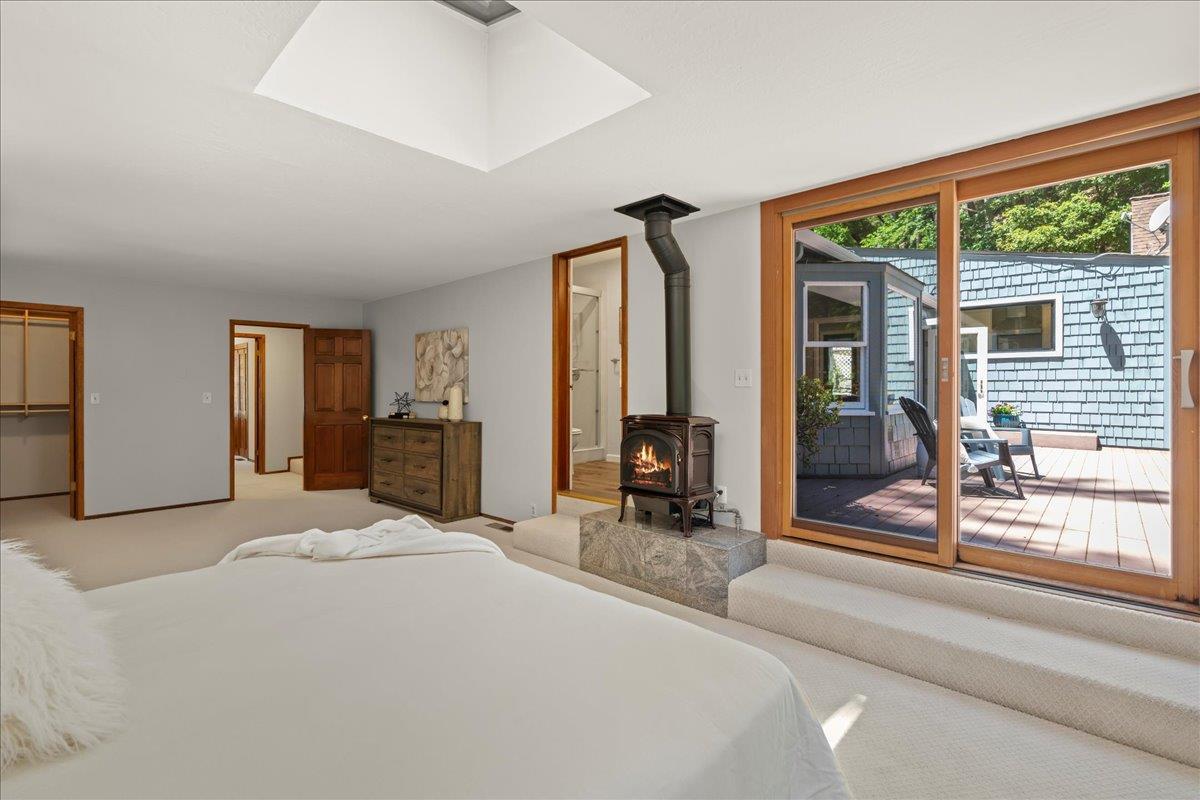 19005 Old Vineyard Road Los Gatos, CA 95033 - Photo 20 of 51 a large bedroom with a large window and furniture