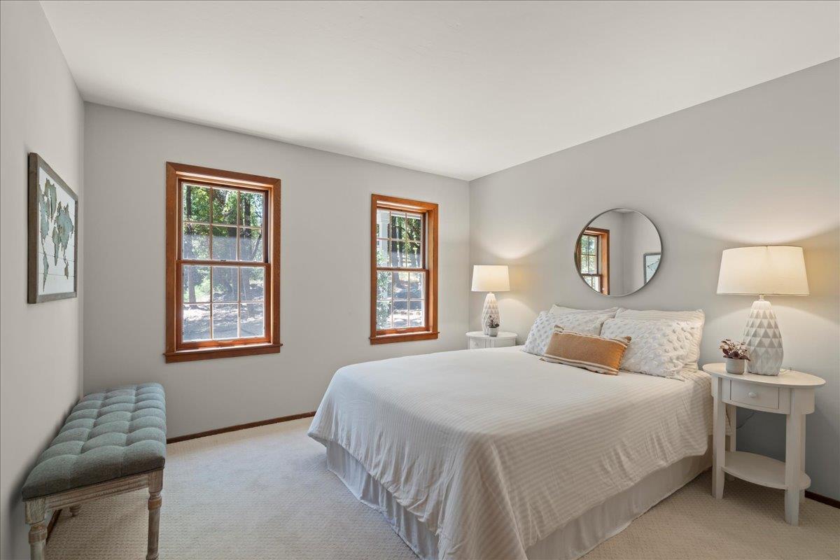 19005 Old Vineyard Road Los Gatos, CA 95033 - Photo 22 of 51 a bedroom with a bed chair and window